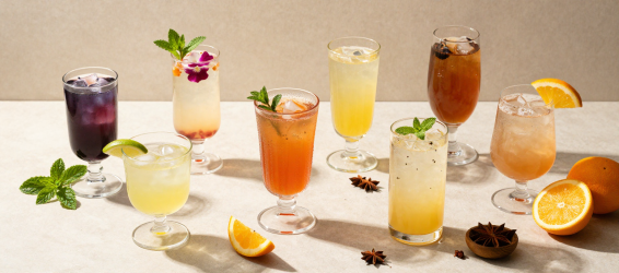 Six mocktail styles arranged on bar